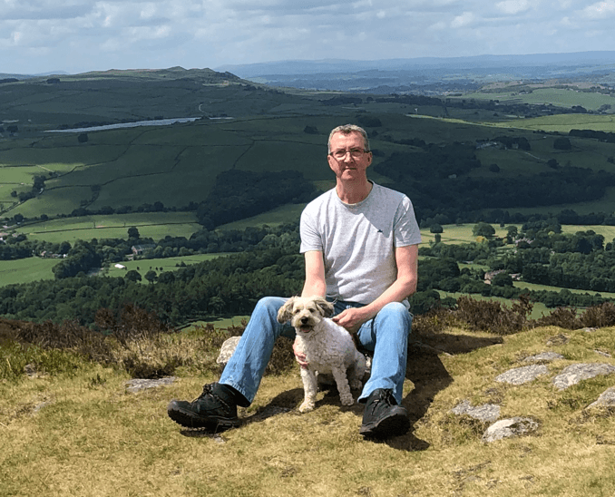Chris Towland out on the hills with his dog